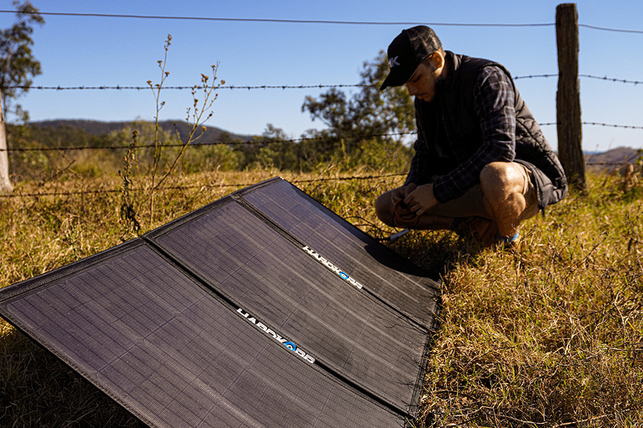 Solar panels lined up in direct sunlight.