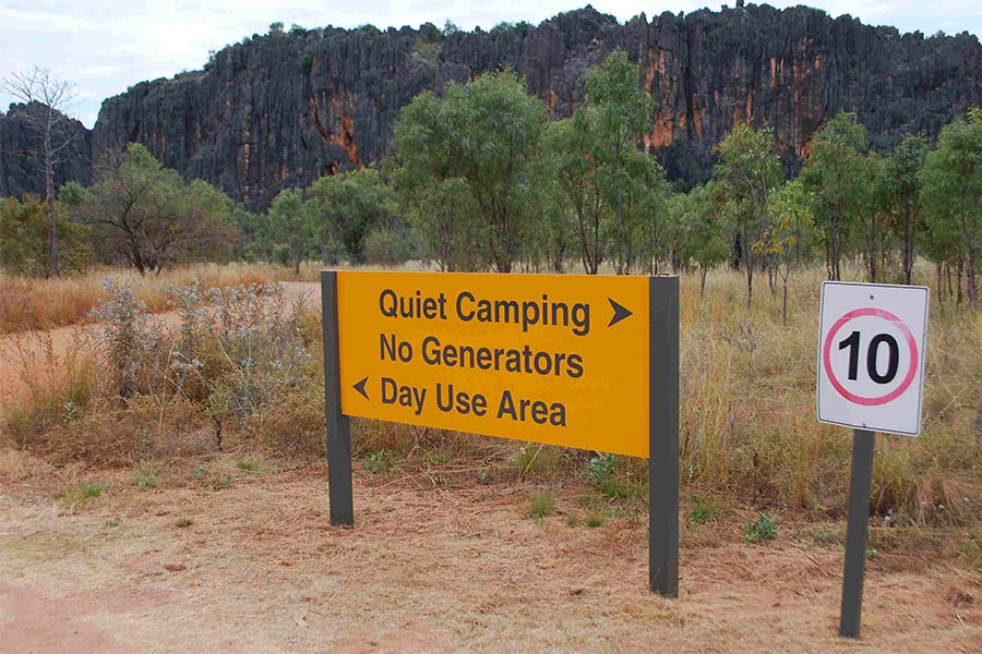 Sign to signal to keep noise down at campsite