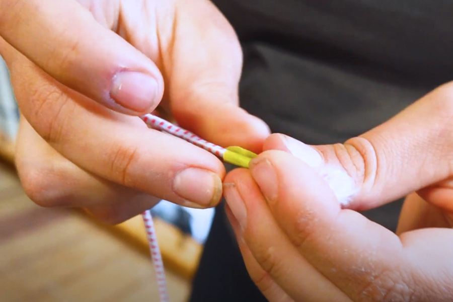 Add tape to rope to make it easier to thread into tent pole
