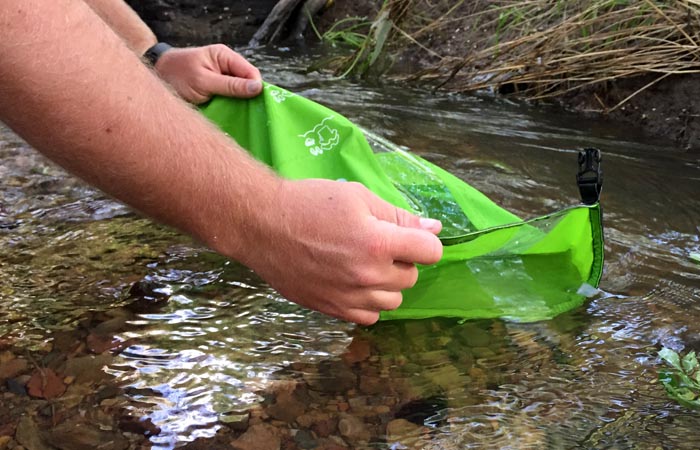 Scrubba Wash Bag - Filling With Water From a CReek