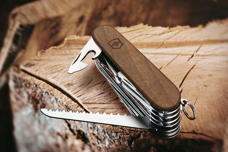 Victorinox Swiss Army Knife on a wooden log. 