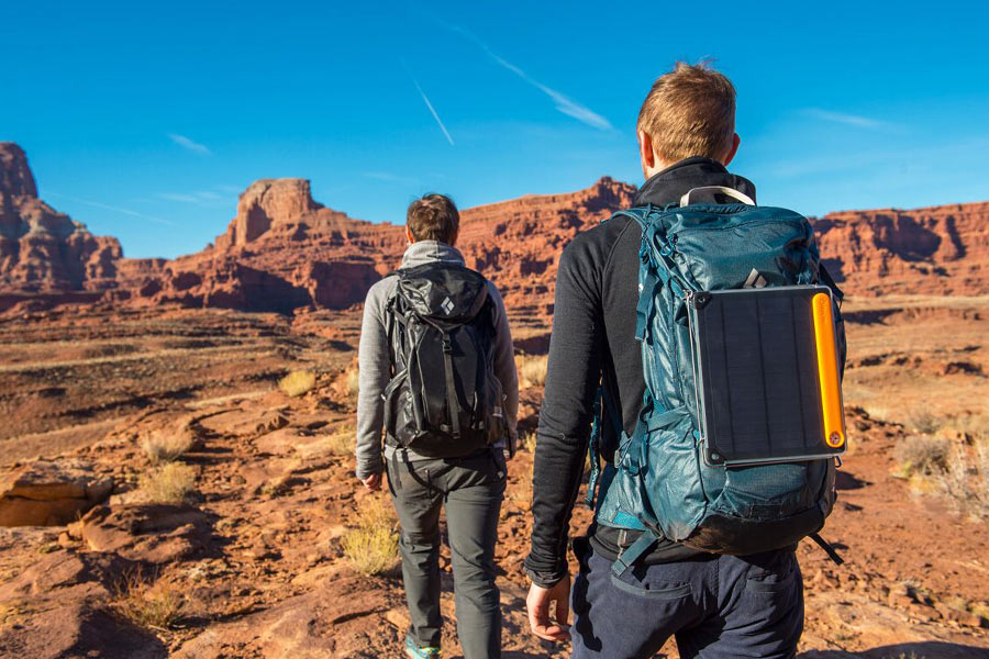 Two men hiking the desert.