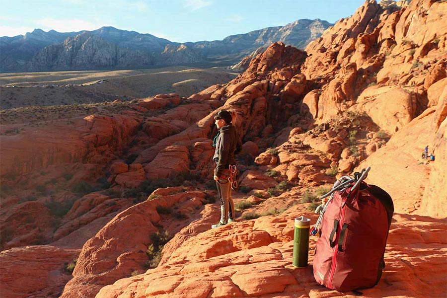 Hiking with Grayl water bottle early in morning.