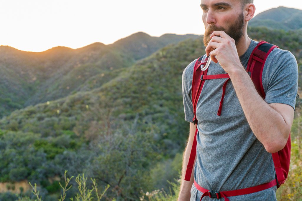 Man drinking from hydration pack