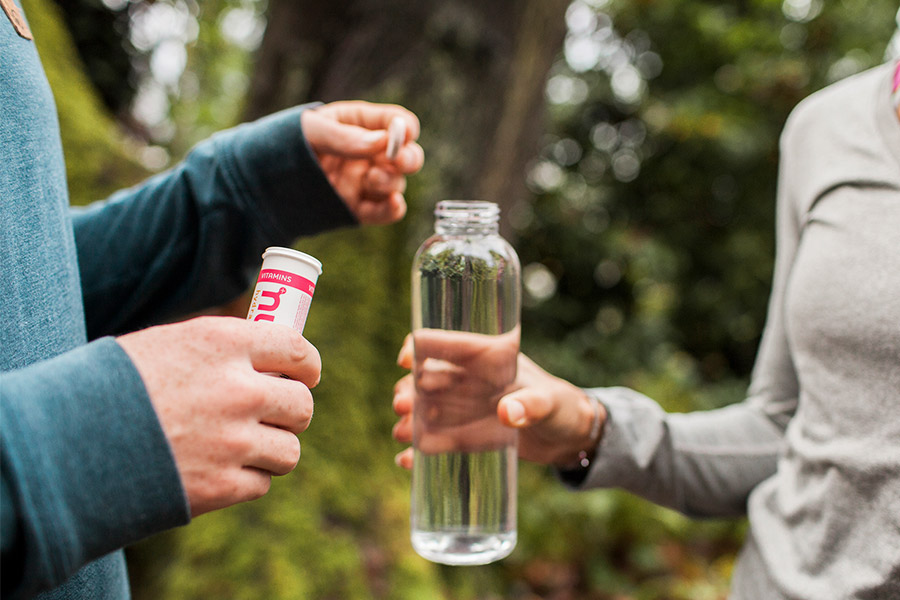 Hikers putting a Nuun tablet into their drink bottle