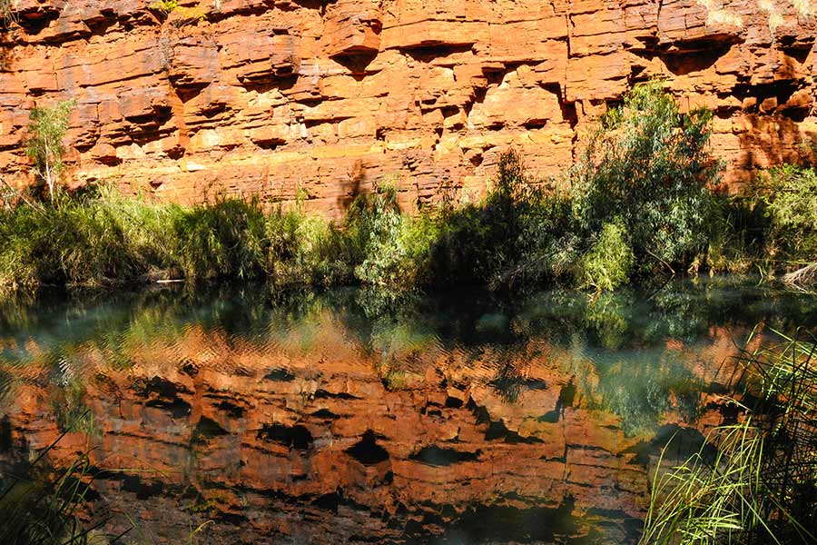 Incredible reflections of the rock face on the water.