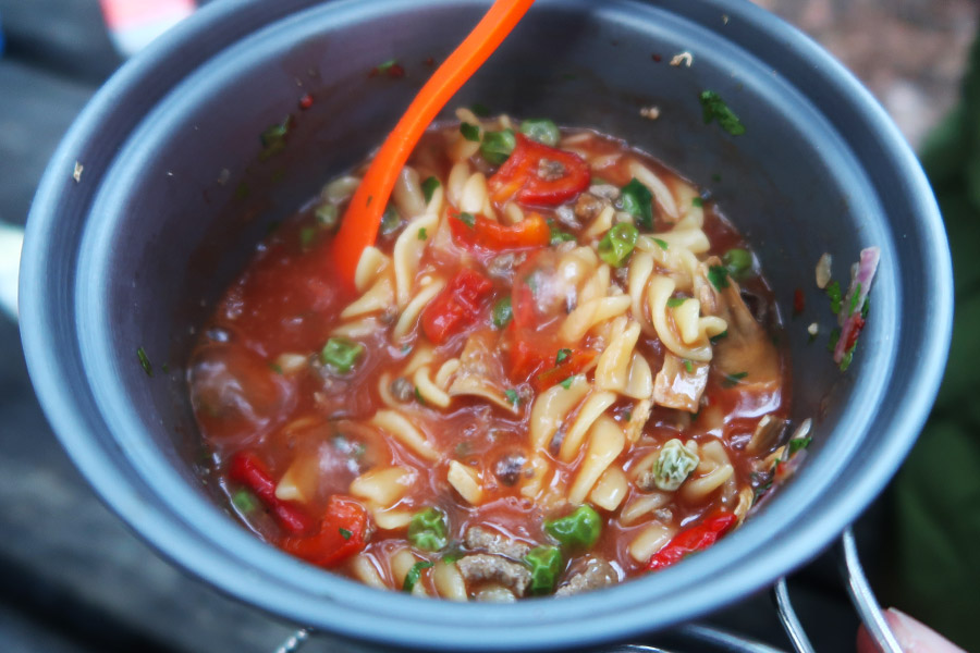 Close up of cooked pasta in a bowl outdoors