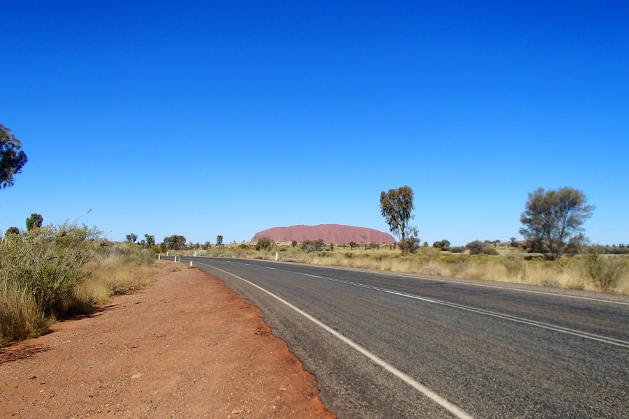 Uluru can be seen in the distance