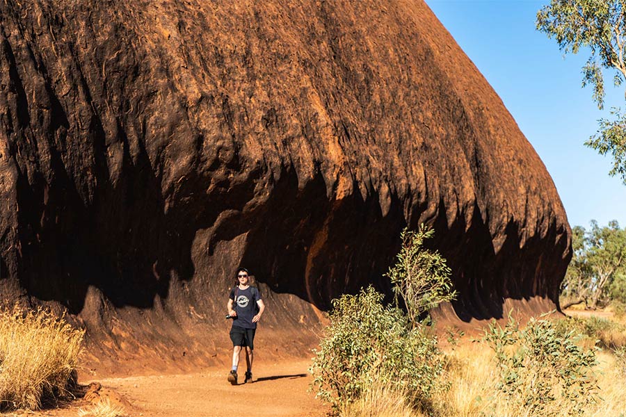 Man walking the Uluru Base Walk