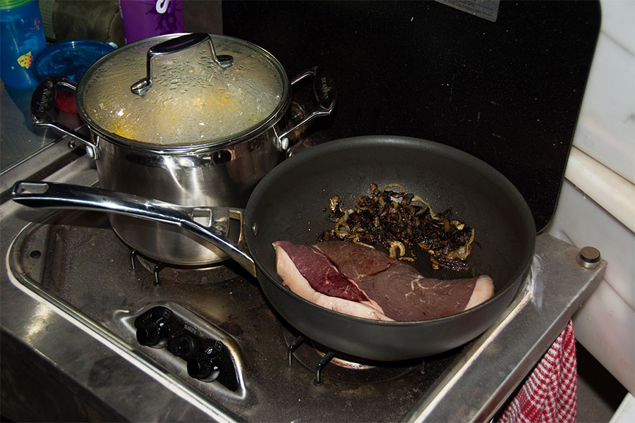 Cooking steak-with-mushrooms-and-onions