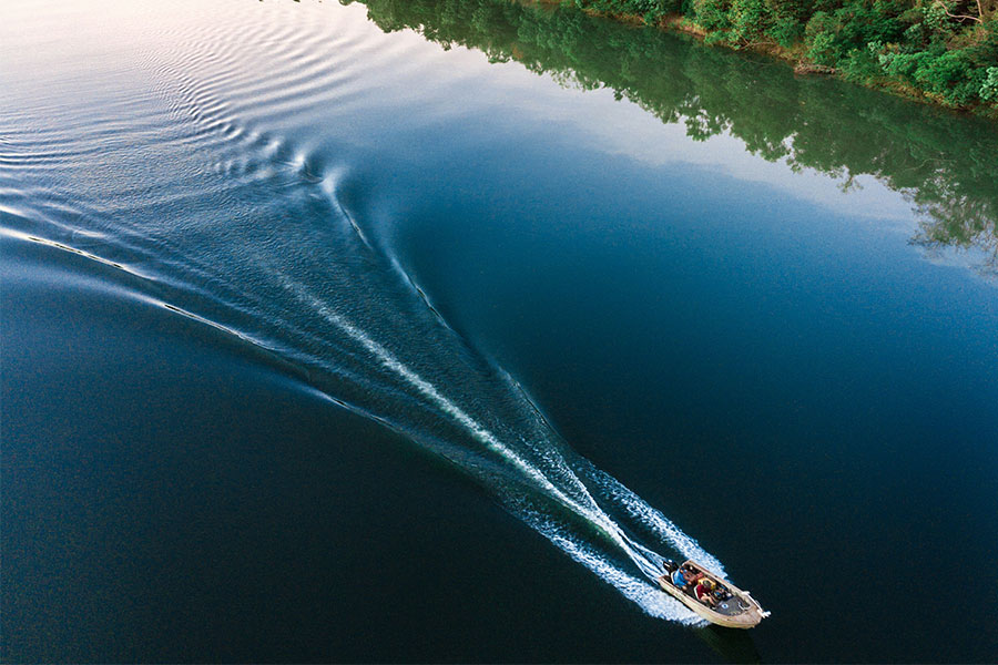 Speed boat gliding across the water in Bynoe, NT