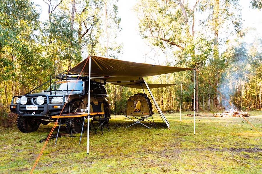 A 4wd with Darche awning and swag setup outdoors