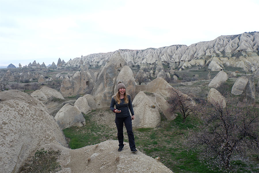 Woman on rocks in Cave city in Turkey