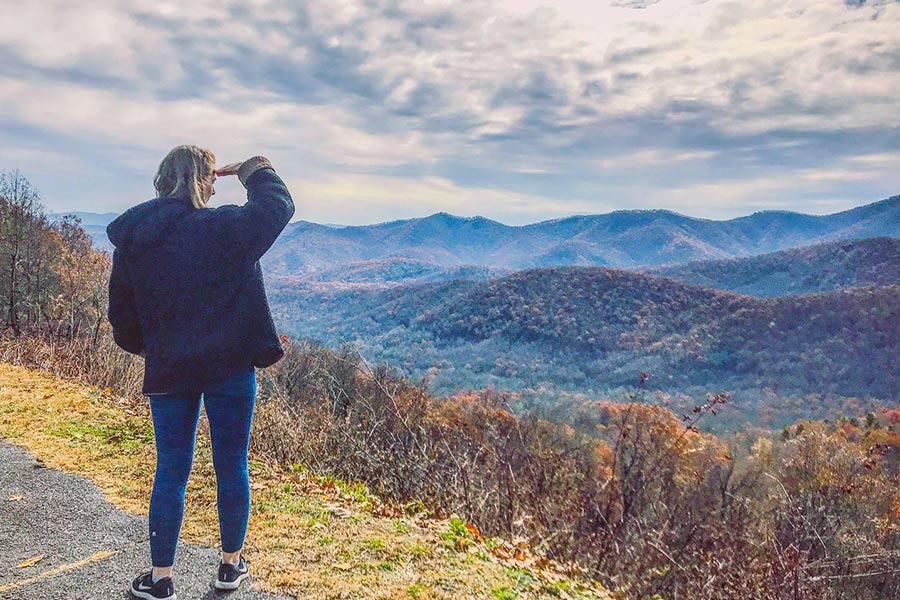 Woman looking out at the mountains in Asheville