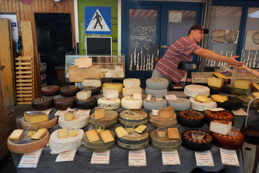 Man selling cheese at a stand in Vienna