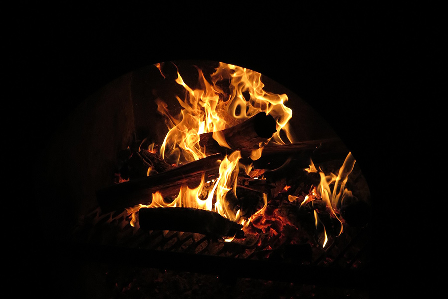 Closeup of burning campfire with wood