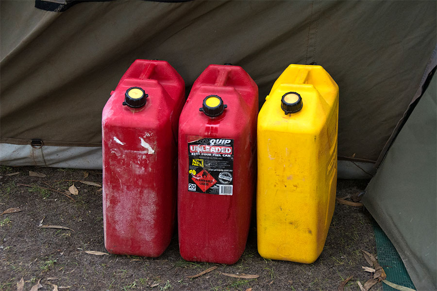 Three jerry cans full of fuel