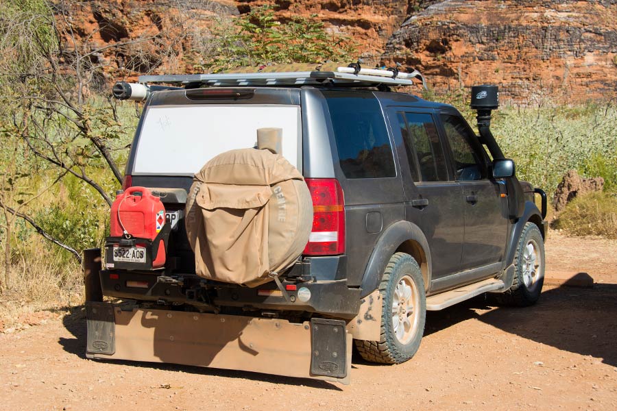 4wd with fuel jerry can on the back of the the car