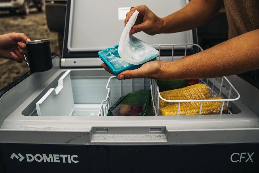 Ice cubes coming out of the icemaker in the Dometic CFX3 55 IM Fridge Freezer