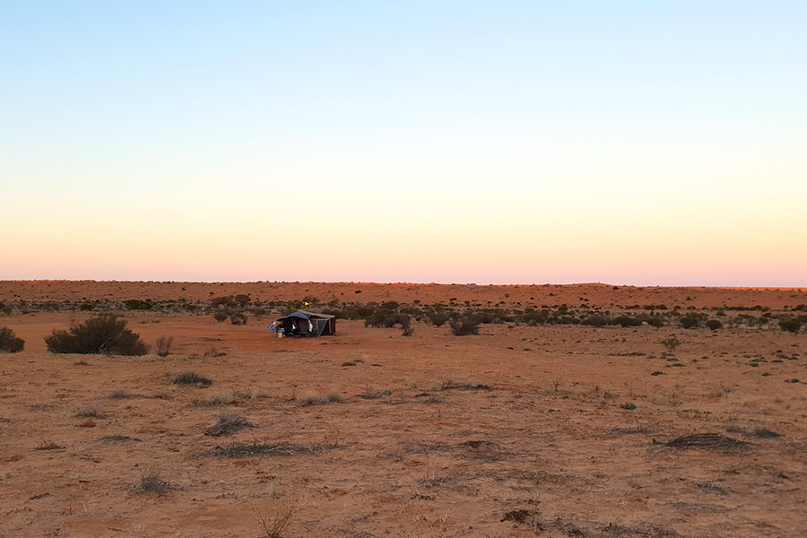 People remote camping at dawn