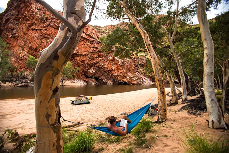 Man lying in hammock out in the Australian outback