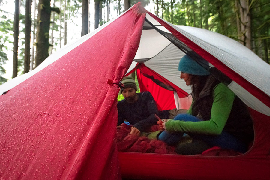 Couple sitting inside MSR hiking tent