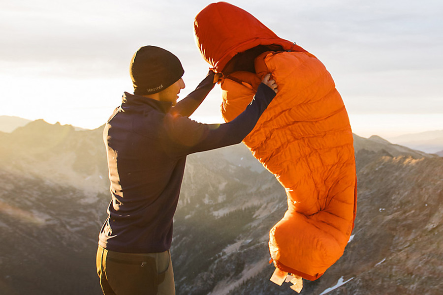 Man shaking Marmot hiking sleeping bag