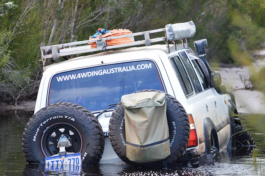 A 4WD in the midst of a river crossing