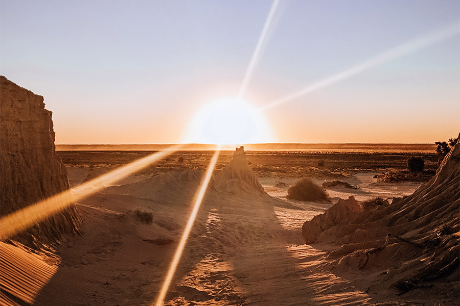 A spectacular sunset over the ancient desert landscape of Mungo National Park.