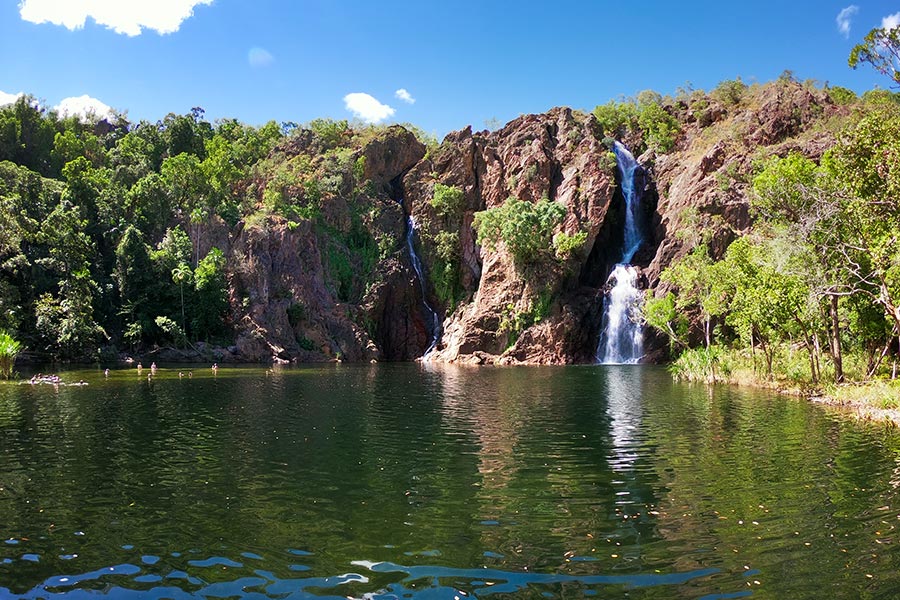 A wide shot of Wangi Falls in Litchfield National Park. It's a typical dry season blue sky day.