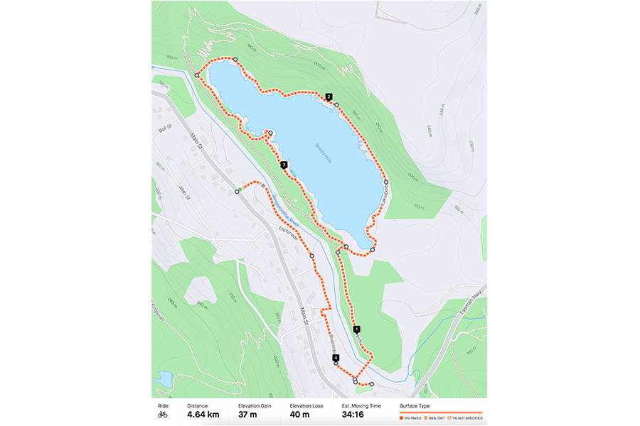 A few circuits of the pump track certainly warmed up the legs before we headed over the suspension bridge to ride a lap of the lake. A Strava-style map of a bike route, with a red dotted line indicating where the bike rider has traversed.