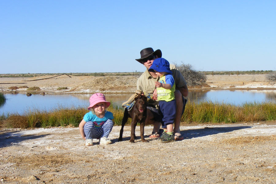 Family with puppy stretching their legs along the Bridsville Track.
