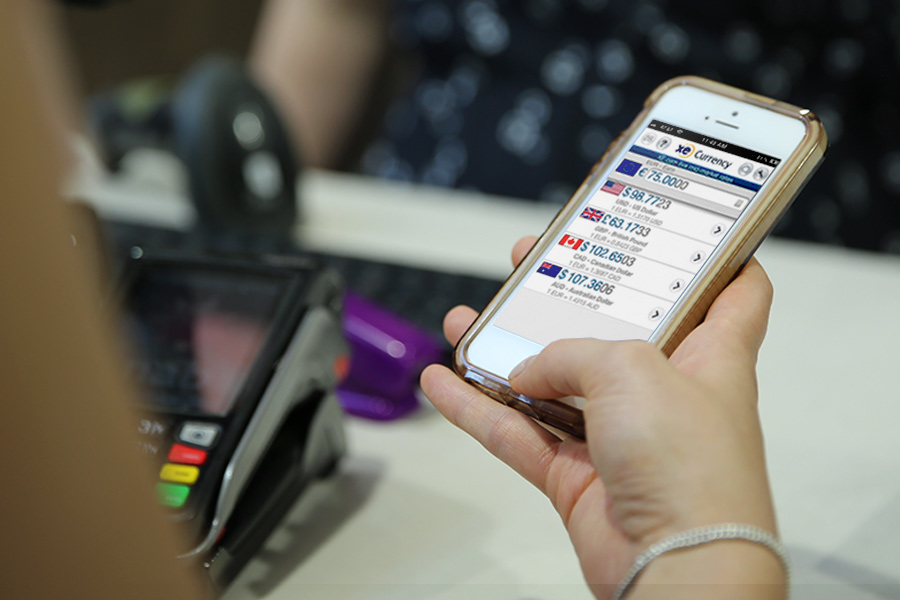 XE Currency app open on a smart phone.