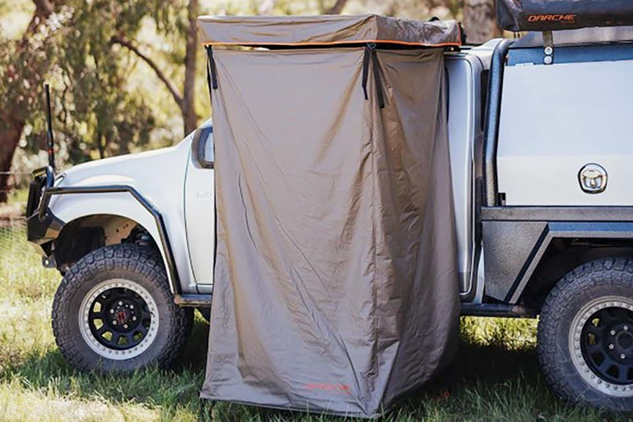 A Darche shower tent attached to a 4WD.